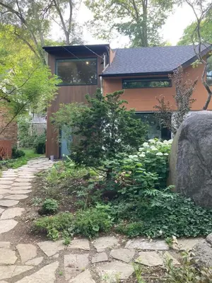 a house with a stone walkway in front of it at Entire Queen Loft in Toronto