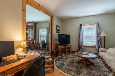 a living room with a couch and a table at Emilyville Inn in Campbellford