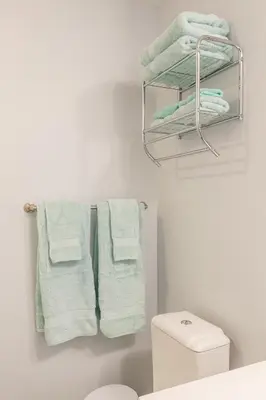 a bathroom with white towels hanging on a rack at Urban Skyline in Toronto
