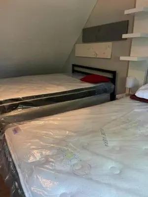 a bedroom with two beds in a room with at Wasaga Beach Loft 4 in Wasaga Beach