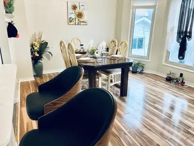 a dining room with a table and chairs at Cheerful residence in Niagara Falls