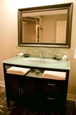 a bathroom with a sink and a mirror at Sapience Retreat & Apothecary in Niagara on the Lake
