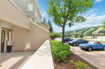 a house with two cars parked in a parking lot at Lovely 3 Bedroom Wintergreen Retreat w Sauna in Blue Mountains
