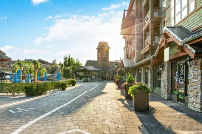 an empty street in a town with buildings at Contemporary Chalet Steps to Blue Mountain Village in Blue Mountains