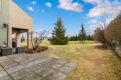 a backyard of a house with a driveway at Luxury Blue Mtn Getaway w Indoor Sauna in Blue Mountains