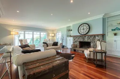 a living room with a couch and a fireplace at Family Lakeside Oasis in Innisfil