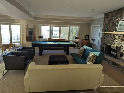 a living room with a pool table and couches at Family Lakeside Oasis in Innisfil