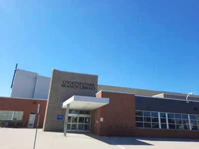 a brick building with a sign on the side of it at Home Stay near the Airport in Mississauga