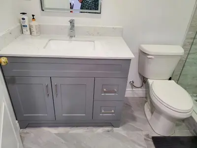 a bathroom with a sink and a toilet at Home Stay near the Airport in Mississauga