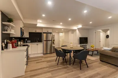 a kitchen and living room with a table and chairs at Luxurious and Spacious Apartment with 2 bedrooms and 2 Baths in Mississauga