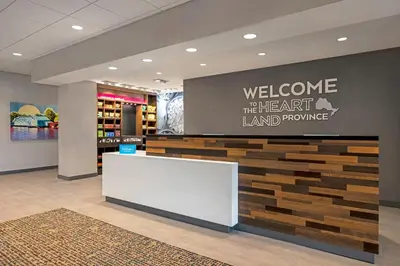 a welcome to the herart island prompting sign in a store lobby at Hampton Inn Midland, On in Midland