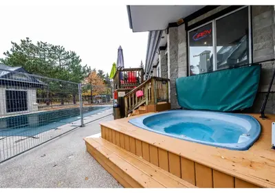 a jacuzzi tub sitting outside of a building at Blue Heart Mountain Studio Dream Walk to slopes, tennis in Blue Mountains