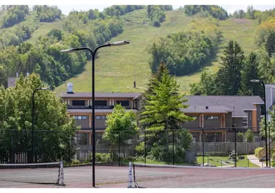a building with a tennis court and a street light at Blue Heart Mountain Studio Dream Walk to slopes, tennis in Blue Mountains