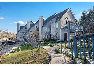a large house with a staircase in front of it at Blue Heart Mountain Studio Dream Walk to slopes, tennis in Blue Mountains