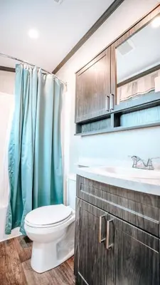 a bathroom with a toilet and a sink at Bellmere Winds Resort in Keene