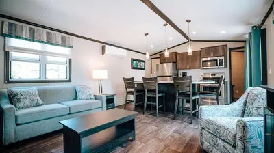 a living room with a couch and a table at Bellmere Winds Resort in Keene