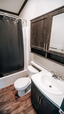 a bathroom with a toilet and a sink at Bellmere Winds Resort in Keene