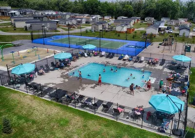 an overhead view of a swimming pool with people in it at Bellmere Winds Resort in Keene