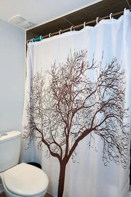 a shower curtain with a tree on it in a bathroom at Peace Alcove in Milton