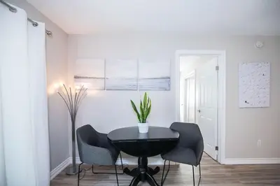 a dining room with a table and two chairs at Slopeside Sanctuary - Ski In/Ski Out in Blue Mountains