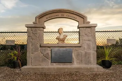 a monument to a statue in front of a fence at Villa di Casa - Boutique Hotel in Wellington