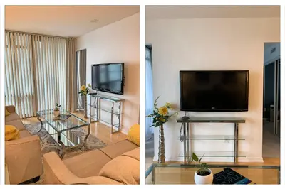 a living room with a flat screen tv and a couch at Cozy Condo in Centre of Downtown Toronto in Toronto