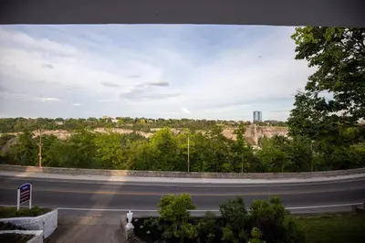 a view of a road with a building in the distance at Niagara Luxury Suites in Niagara Falls