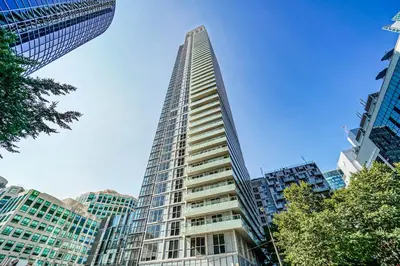 a tall building in the middle of a city at RHD Luxury Condos-Downtown, CN Tower, Metro Toronto Convention Centre, Rogers Centre, Free Parking in Toronto