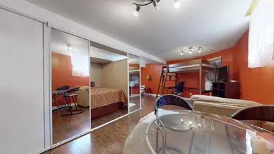 a room with a bed and a room with a table at ZARA's UNIQUE APARTMENT in Mississauga