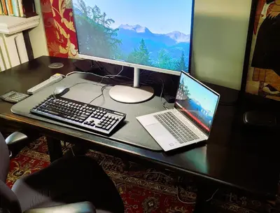 a desk with a laptop and a computer monitor at Four Bedroom Rosedale Home in Toronto