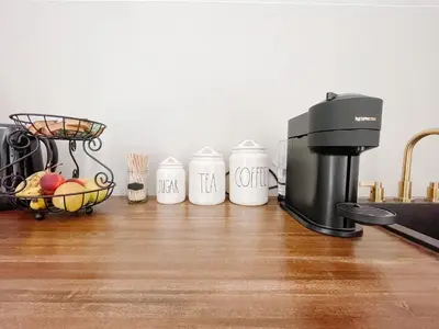 a group of five coffee cups sitting on a kitchen counter at Inn On King Bed & Breakfast in Niagara on the Lake