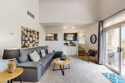 a living room with a couch and a table at Wintergreen 126 in Blue Mountains