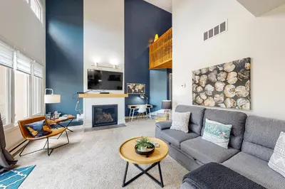 a living room with a couch and a fireplace at Wintergreen 126 in Blue Mountains