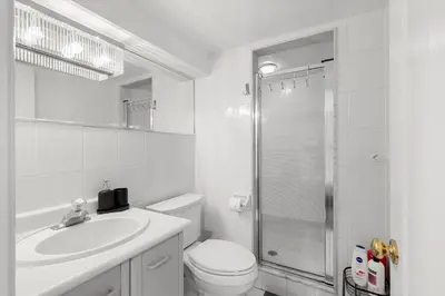 a bathroom with a toilet and a sink and a shower at Home Away From Home in Richmond Hill