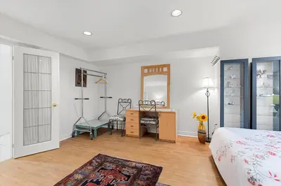 a bedroom with a bed and a desk and a table at Home Away From Home in Richmond Hill