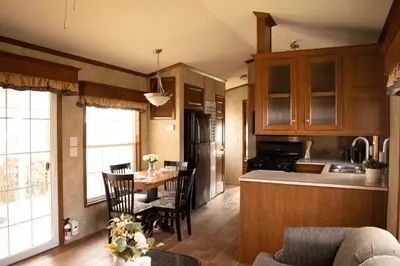 a kitchen and dining room with a table and chairs at Vine Ridge Resort - Cottages in Niagara on the Lake