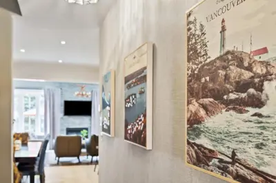 a dining room with posters on the wall at Exceptional 3 BDRM Townhome - 4 Seasons Rental in Collingwood