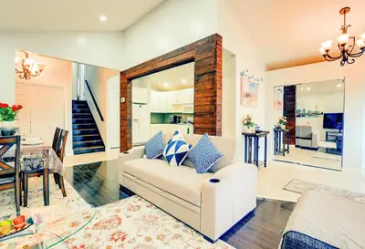 a living room with a white couch and a table at Furnished Family Home near Toronto - Great Location Game Room - Backyard - Parking & Self Checkin in Pickering