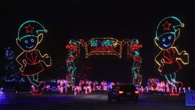 a group of christmas lights in front of a house at Farmhouse Resort in Midhurst