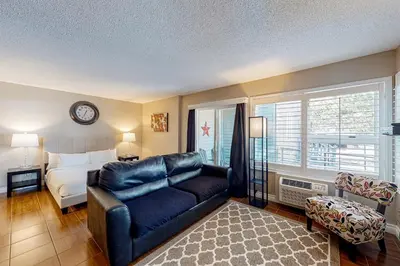 a living room with a couch and a bed at Condo 204 at North Creek Resort in Blue Mountains