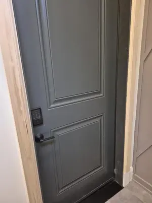 a grey door with a door knob on it at Gabby's Place Downtown Core in Toronto