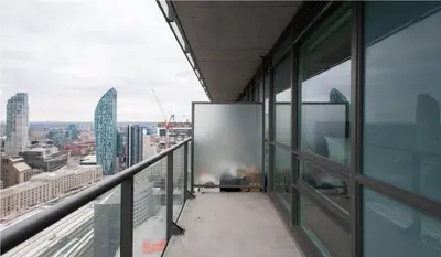 an office balcony with a view of a city at Toronto Downtown Core Two Bedroom Condo with CN Tower View, Free Parking in Toronto