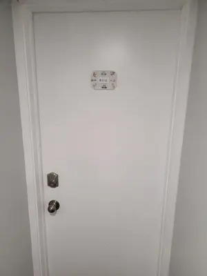a white door with a sign on it at Guest House Basement - Master Bedrooms in Bayview Village in Toronto