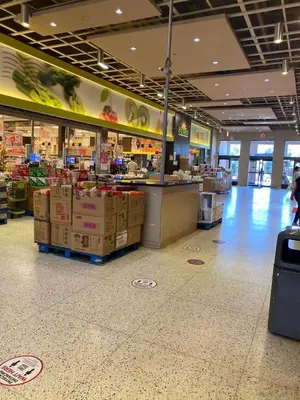 a grocery store aisle with a counter in a store at Guest House Basement - Master Bedrooms in Bayview Village in Toronto