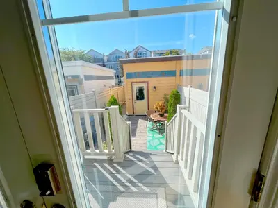 an open balcony with a view of a house at Stunning Rooms in Townhouse across the Beach in Toronto