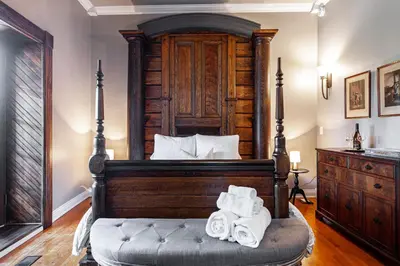 a bedroom with a bed with towels on it at Lake Suite with Sunroom by Henry House Stays in Stratford