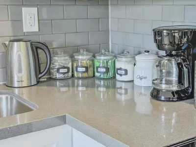 a kitchen counter with jars and a blender on it at Harbour House in Hamilton