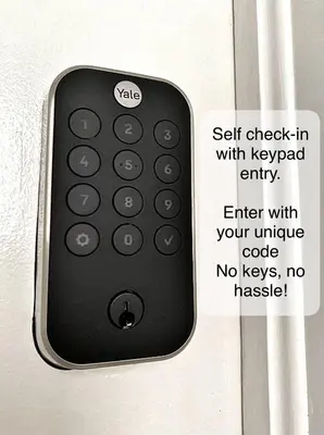 a remote control is attached to a door at Harbour House in Hamilton
