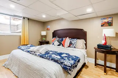 a bedroom with a bed with pillows on it at The Rustic Barn in Brampton