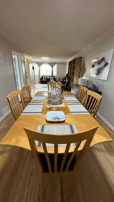a large wooden table with chairs and a dining room at Full Privacy Apartment with Free Parkrings in Toronto